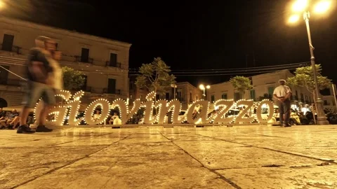 Evening time-lapse of the city letters monument in Giovinazzo, Italy Stock Footage 315566548
