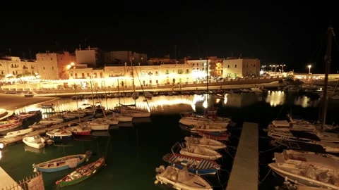 Evening time-lapse of the marina in the old town of Giovinazzo, Italy Stock Footage 315555155