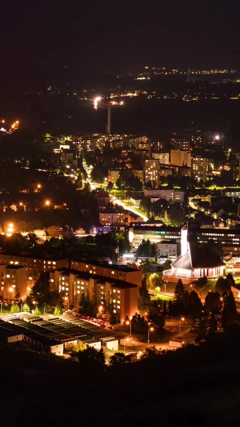 Evening Time Lapse of Small City with Busy Traffic and Glowing Street Lights Stock Footage 313905017