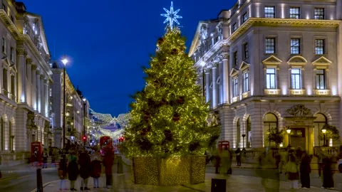 Evening time lapse view of the christmas tree at Waterloo Place in London Stock Footage 261038496