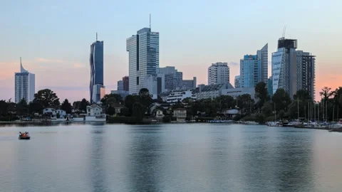 Evening time-lapse view of the Donau city district with the river Stock Footage 242134470