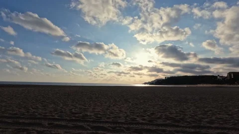 Evening time timelapse at beach with fluffy clouds on blue sky Stock Footage 169100124