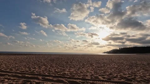 Evening time timelapse at beach with fluffy clouds on blue sky Stock Footage 169100289