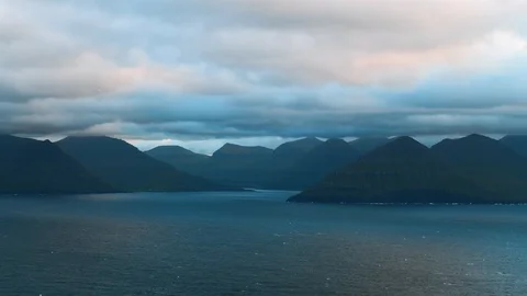 Evening timelapse with moving clouds and blue mountain peaks Stock Footage 120886300