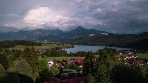 Evening Timelapse of Sun and Building Clouds over Lake Weißensee, Säuling Stock Footage 344327603