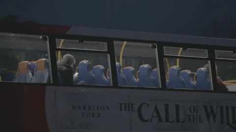 Evening in Torquay. Bus with single passenger pulling away. Stock Footage 179530734