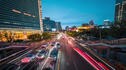 Evening Traffic Flowing Through Busy Urban Intersection Stock Footage 336225789
