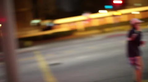 Evening traffic with headlights through intersection Stock Footage 46804835