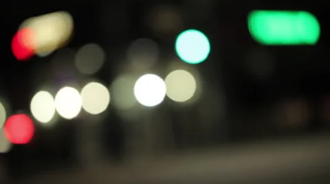 Evening traffic with headlights through intersection Stock Footage 46804922