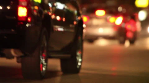 Evening traffic with headlights through intersection Stock Footage 46805721