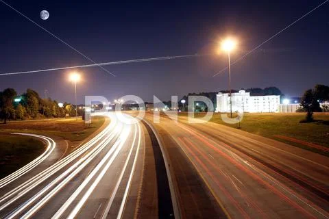 Evening traffic on highway Stock Photos