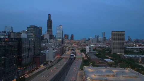Evening traffic on Kennedy Expressway moving towards downtown Chicago skyline wi Stock Footage 337312736