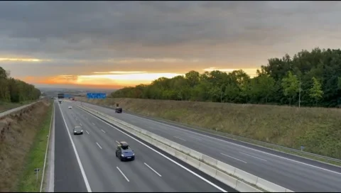 Evening Traffic on Multi Lane Autobahn Highway at Sunset Stock Footage 345364322