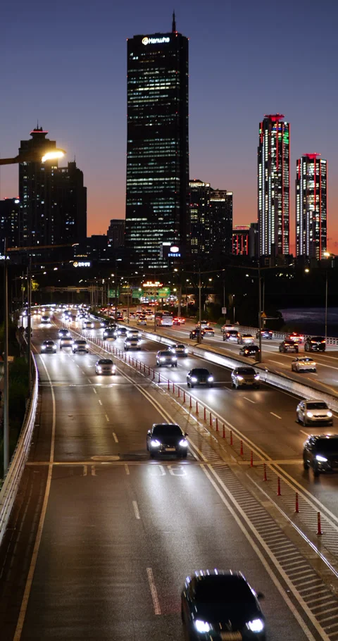 Evening traffic on Olympic daero and 63 Square skyscraper against sunset sky Stock Footage 295083196