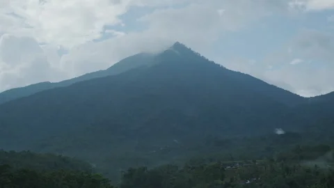 Evening in tropics in front of green mountain. Stock Footage 130483345