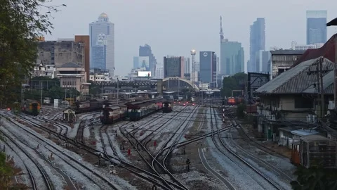 Evening view of Bangkok train station. Skyscrapers in background. Stock Footage 277577133