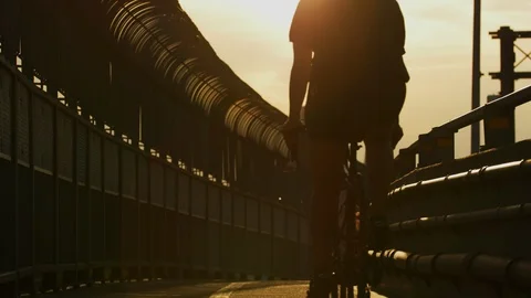Evening view of a bicyclist Stock Footage 99910404