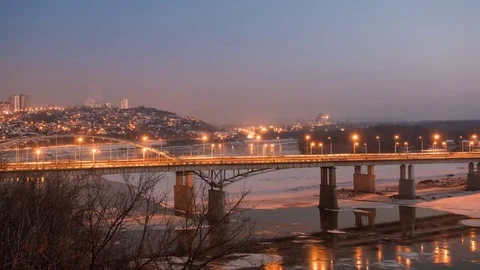 Evening view of bridge over White River in Ufa at winter, Russia, timelapse. Stock Footage 83361020