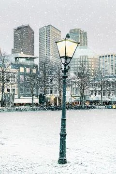 Evening view during winter with lantern of The Hague city center with the "Pl Stock Photos