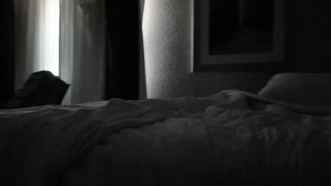 Evening View of a Hotel Room With Unpacked Luggage and Messy Bed Stock Footage 288901693