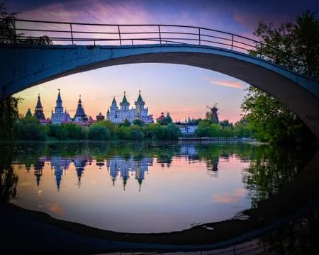 Evening view on Izmailovsky Kremlin with reflections in lake. Stock Photos