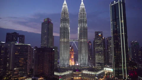 Evening view of the KLCC Park and Petronas Twin Towers Stock Footage 250497934