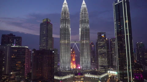 Evening view of the KLCC Park and Petronas Twin Towers Stock Footage 264806978