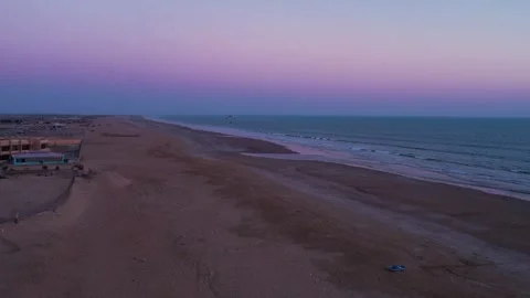 Evening view of Kund Malir Beach with a distant paraglider Stock Footage 261558236