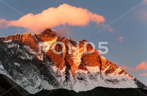 Evening view of Lhotse and clouds on the top, warm tone - way to mount Everes Stock Photos