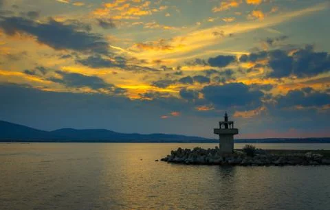 Evening view of lighthouse at sunset Stock Photos