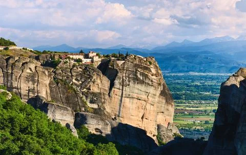 Evening view of monastery of Holy Trinity or Agia Triada and rocky pillars Stock Photos