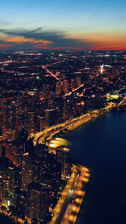 An evening view Oak Street Beach towards the Chicago waterfront. Shining street Stock Footage 276901217