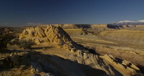 Evening view overlooking the tortured landscape of Strike Valley, Utah Stock Footage 124298136