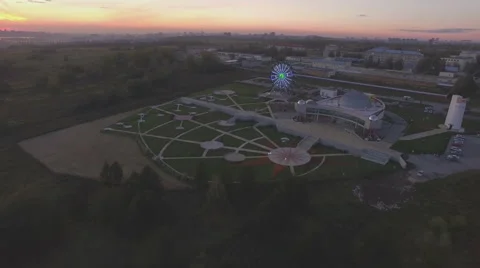 Evening view on the park with Ferris wheel at the evening Stock Footage 55076883