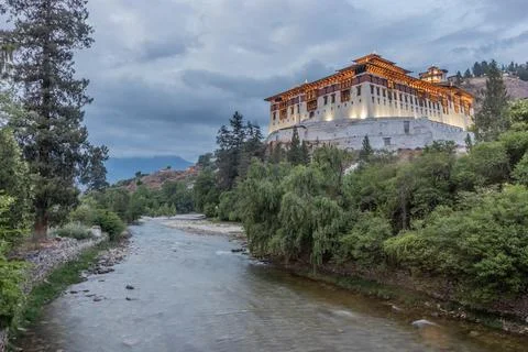 Evening view of Paro river and Rinpung Dzong, Buddhist monastery and fortress Stock Photos