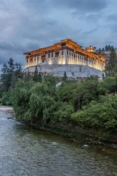 Evening view of Paro river and Rinpung Dzong, Buddhist monastery and fortress Stock Photos