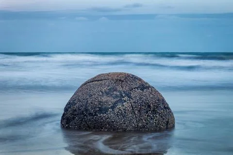 Evening view of perfect spherical stone at Moeraki boulders beach, New Zealan Stock Photos