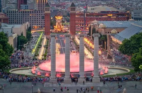 Evening view at the Placa de Espana with colored fointain and coloums from the Stock Photos