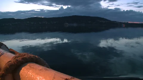 Evening view of the shore with floating vessel Stock Footage 63126750