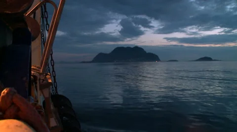 Evening view of the shore with floating vessel Stock Footage 63127004