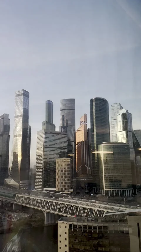 Evening view of skyscrapers and traffic of cars and the metro railway bridge. Stock Footage 239851529