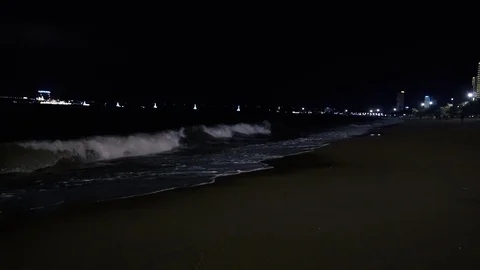 Evening walk along the seashore. The waves beat against the shore white foam Stock Footage 115960148