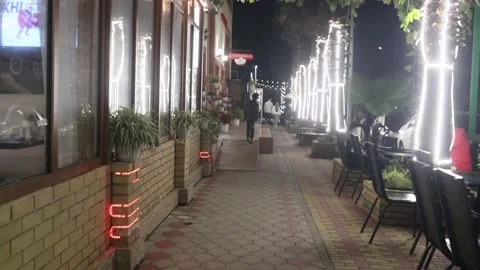 Evening walk around the resort town, near the cafe. Stock Footage 221304741