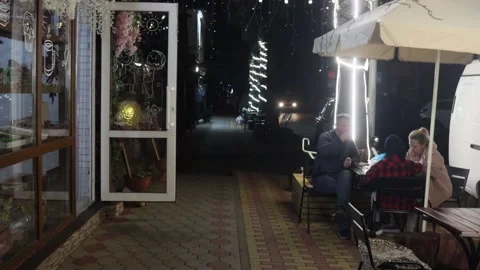 Evening walk around the resort town, near the cafe. Stock Footage 221304792