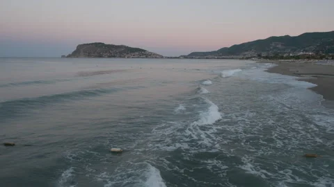 Evening Waves by the Shoreline Stock Footage 282927661