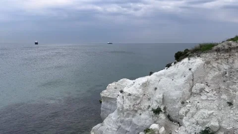 Evening white cliff nea calm sea Stock Footage 240392409
