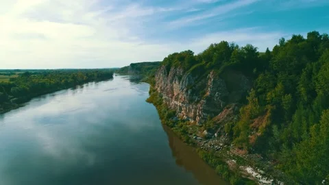 Evening in the wild. The dense forest grows on an impregnable rock. The blue sky Stock Footage 157157078