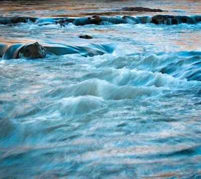 Evening wild river Stock Photos