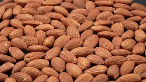 Evenly Lit Tilted Raw Almonds Macro 4K Stockbeeldmateriaal 332842364