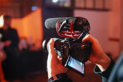 Event filming in progress with camera and microphone setup Stock Photos